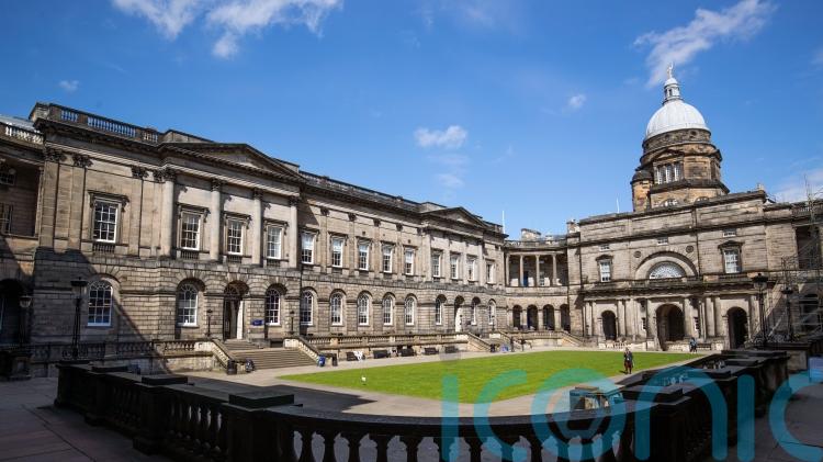 Staff at University of Edinburgh strike over proposed cuts