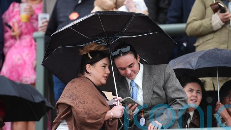 Crowds brave the elements at Aintree ahead of Grand National