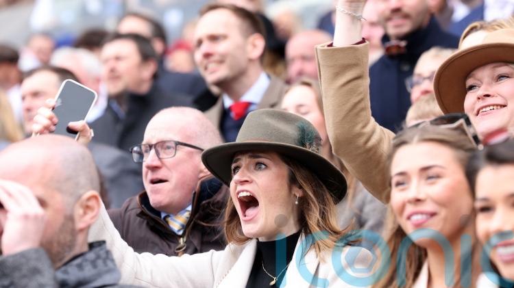 Crowds cheer on as Grand National winner crosses the line