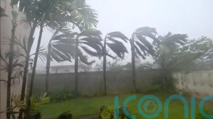 Residents take shelter as major typhoon in Pacific batters remote US islands