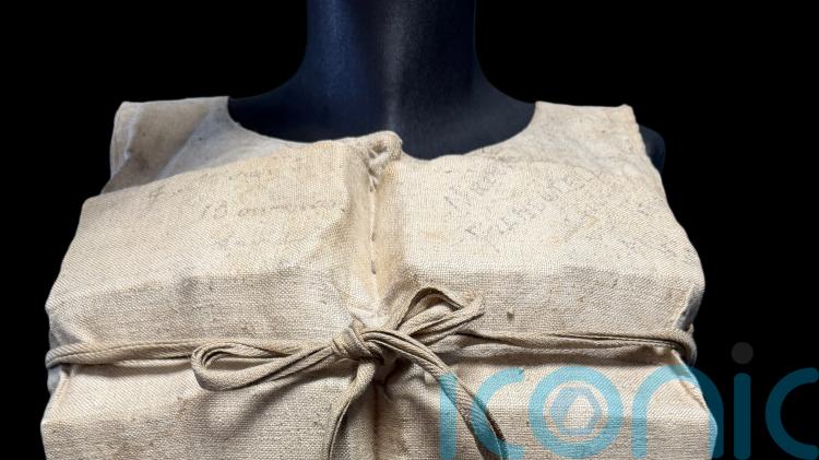 Life jacket used by Titanic survivor sells for &pound;670,000 at auction
