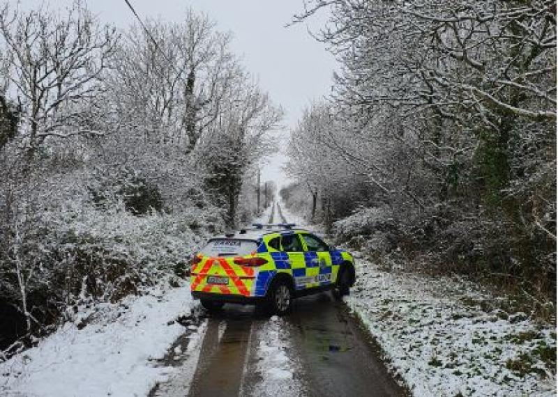 Garda patrol car in treacherous road conditions