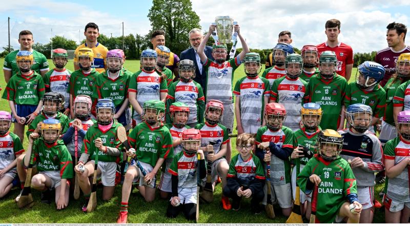 Local kids migle with GAA President Larry McCarthy and the hurling stars