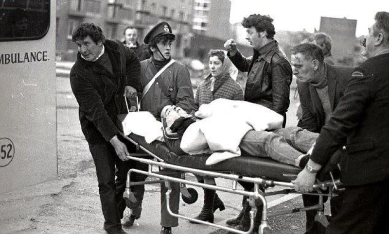 Knights of Malta putting casualty in ambulance. Liam Curley in Jacket and Bernard Feeney in Knights of Malta uniform
