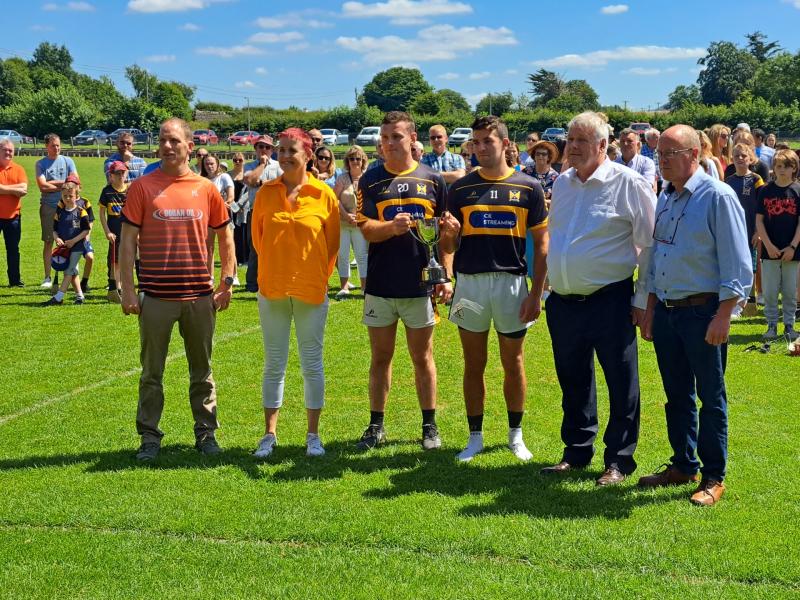 Clonakenny joint captains John Joe Ryan and Bobby Bergin accept the Fr John Joe O'Rourke Cup in Holycross this afternoon