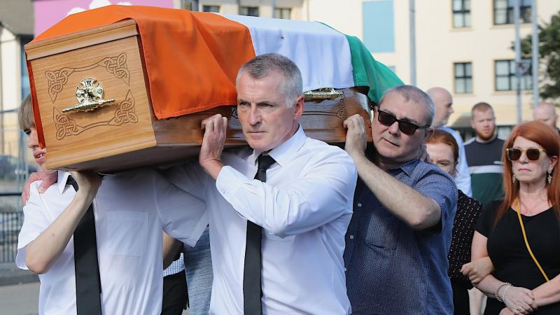 Donncha Mac Niallais' coffin is carried by members of his family through the Bogside before travelling to his home in the Waterside. (Photo - Tom Heaney, nwpresspics).