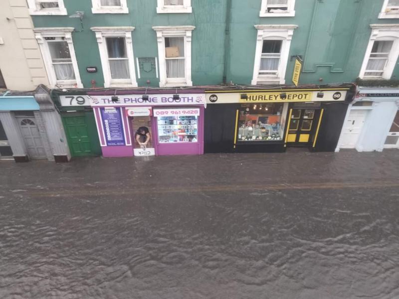 Cars 'soaking' people with flood water in Kilkenny and driving water into businesses
