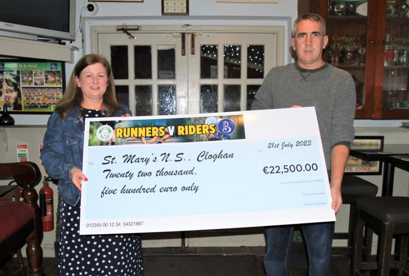 Cheques presented following successful Runners v Riders event