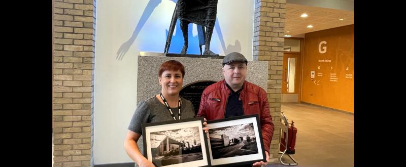 Talented amateur photographer gifts prints of the North Wing Building to the Western Trust