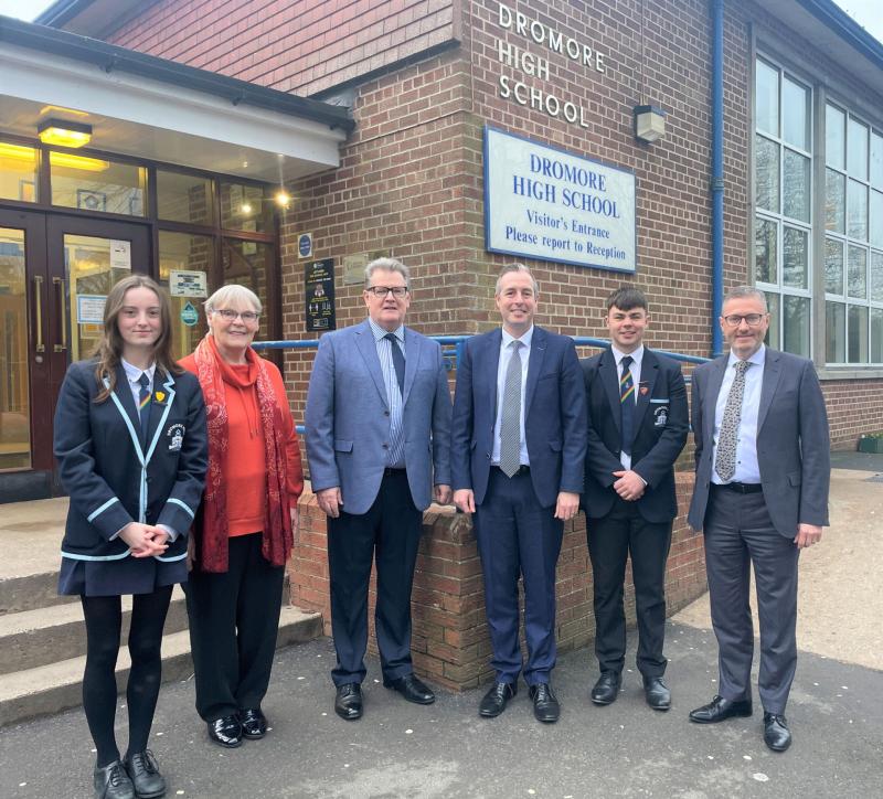 Education Minister Paul Givan with Principal Ian McConaghy (far right), members of the Board of Governors, Head Girl and Head Boy, during a visit to Dromore High School.