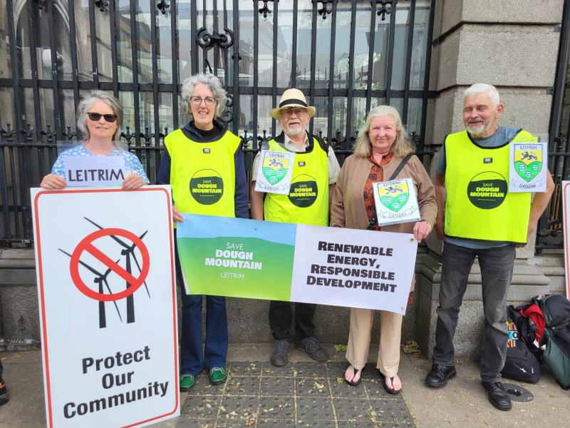 Leitrim groups protest outside Dáil Éireann re: outdated windfarm guidelines