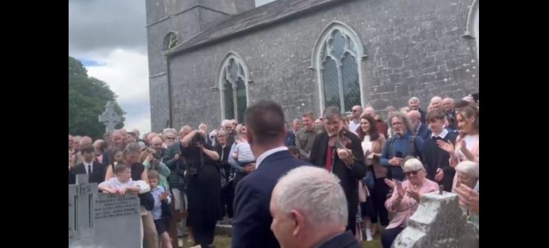 WATCH: Poignant moment at Harry Gleeson's burial as his fiddle is used to lay him to rest