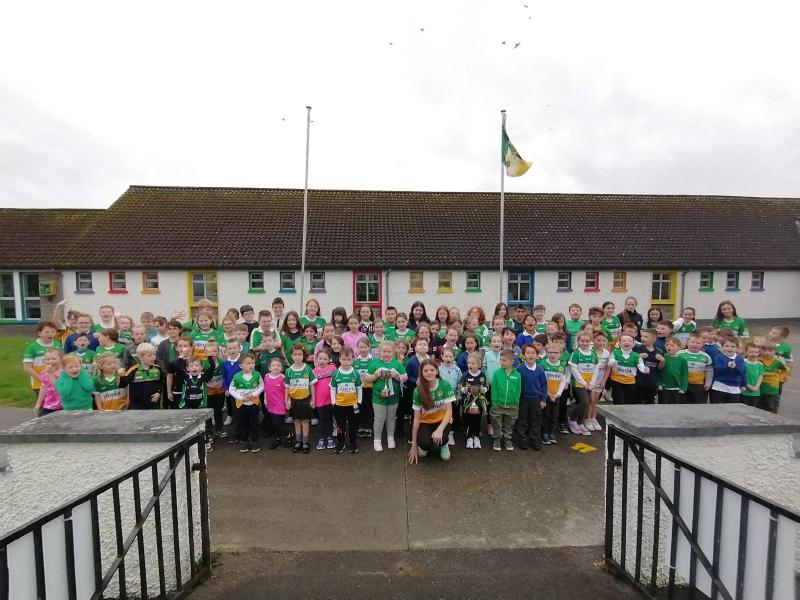 Former pupil brings ladies football trophies back to her old school