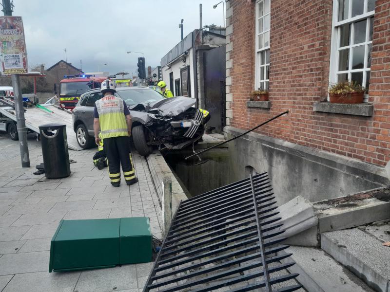 Car left dangling over 12-foot drop in Louth after dramatic crash 