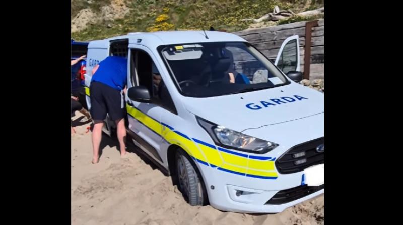 Sun, sea and stuck in the sand: Garda van gets 'beached' in Ballybunion