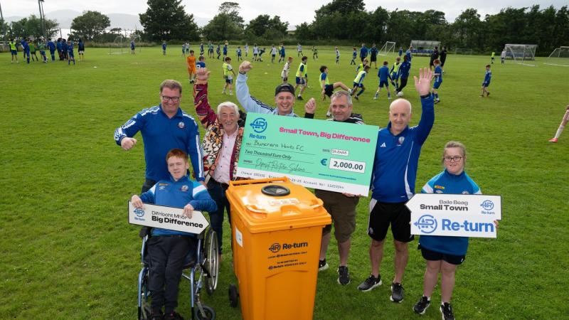Tadhg and Derry Fleming celebrate €2,000 Buncrana Hearts Re-turn winners
