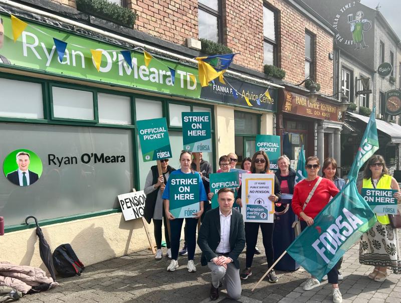 Local TD stands in support with striking school secretaries and caretakers