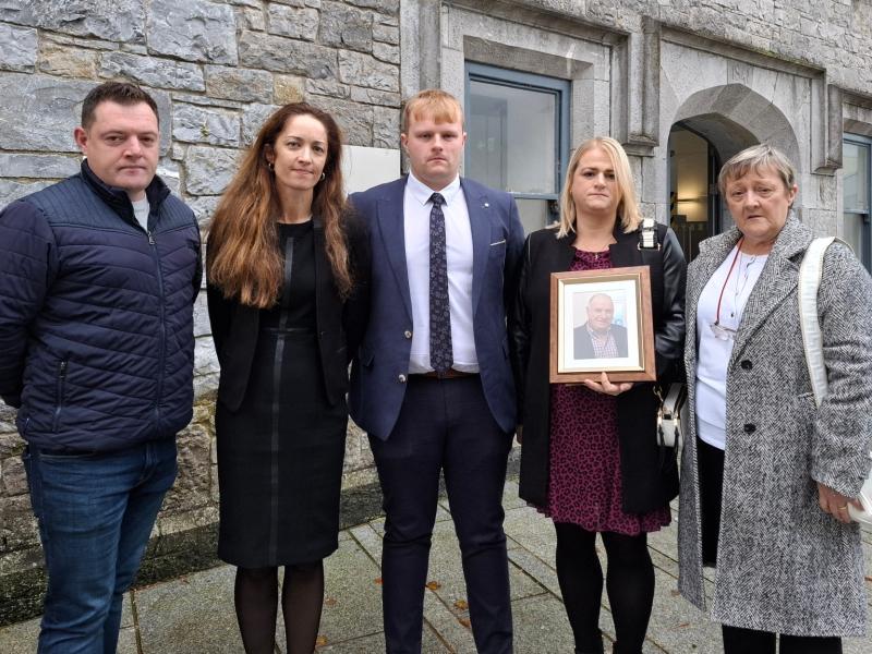 The Lowry family with solicitor