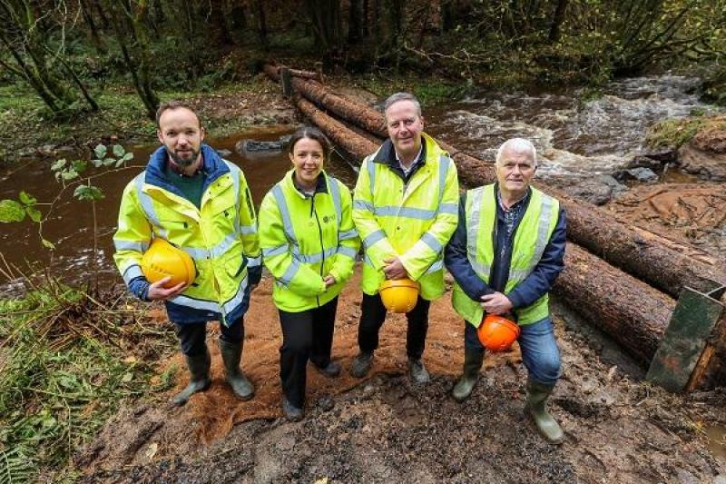  At the “leaky dams” flood mitigation pilot: Mike O’Gorman, DFI Rivers, Infrastructure Minister Liz Kimmins, Gary Quinn, Acting Director of Operations, DFI Rivers & Kenny Acheson DAERA Forest Service.