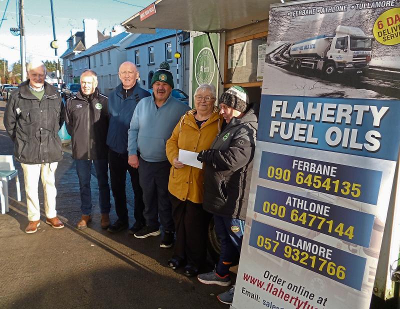 Winner of big jackpot in Offaly club's Lotto draw picks up her cheque