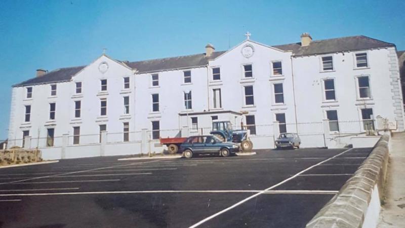 Laois community joy as rescued Abbeyleix historic cross comes home