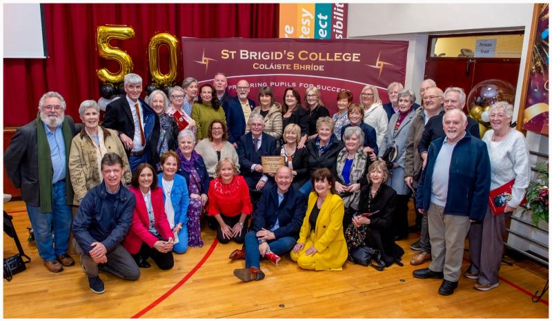 Teachers & pupils from the year St Brigid's opened, with first Principal Frank Dunne centre. PHOTO: PETER KANE.