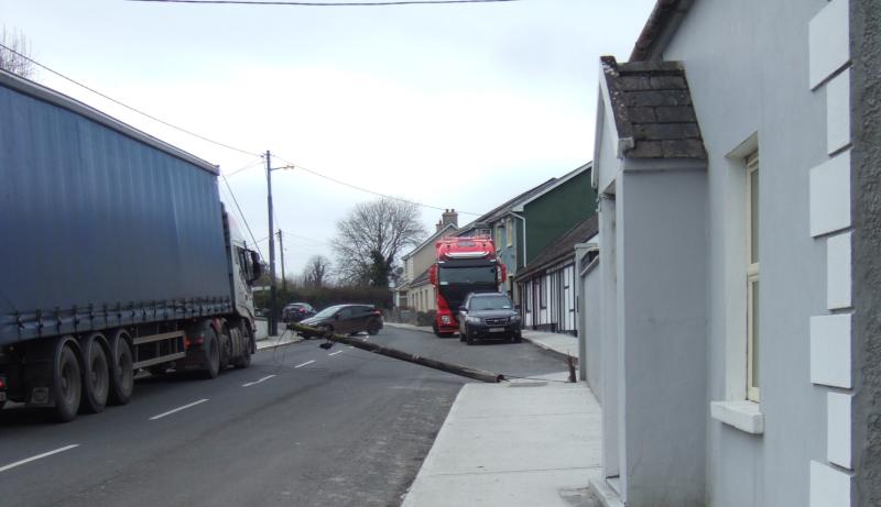Telephone poles snap after lorry hits overhead wires
