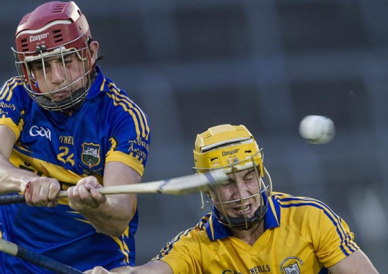 Tipp's Colin O'Riordan being challenged by Clare's Colm Galvin.