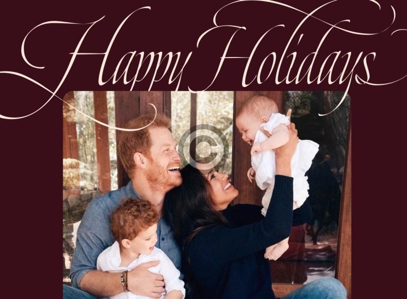 Harry and Meghan smile at daughter Lilibet as Archie looks on in festive message