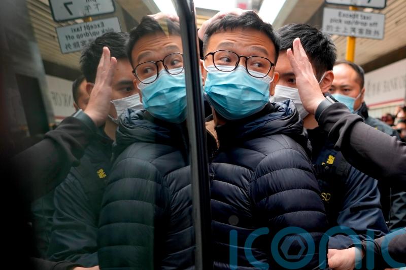 Hong Kong police arrest six people and raid pro-democracy news outlet