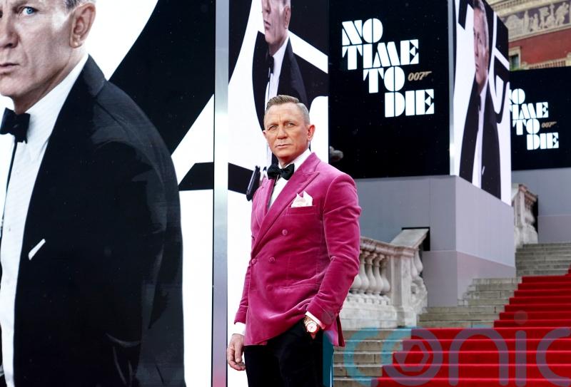 Craig’s Bond exit, Indy and Tom Cruise: The showbiz year in pictures