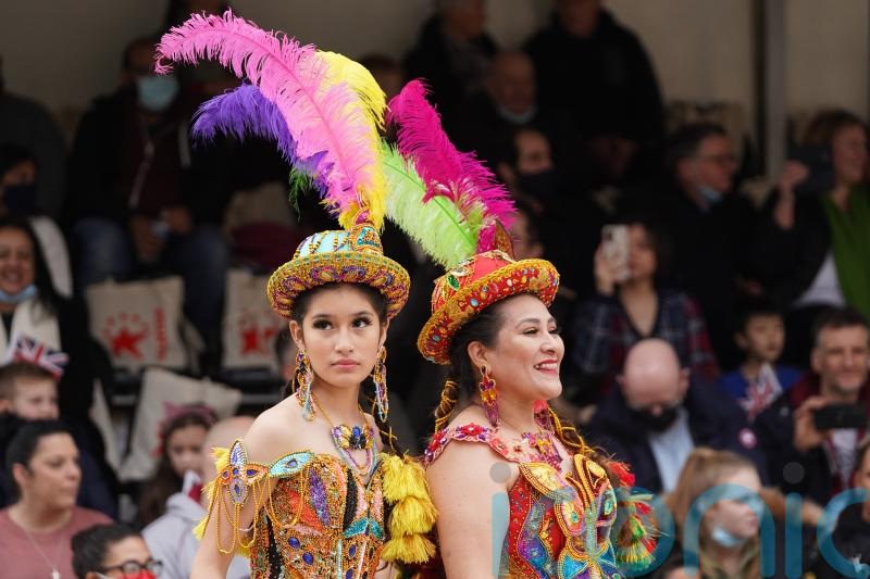 Dancers and bike stunt teams perform at scaled-down return of new year parade