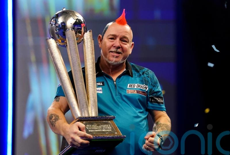 Peter Wright holds nerve to win second world title