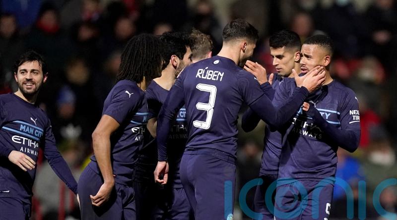 Strong Manchester City side ease past Swindon in FA Cup