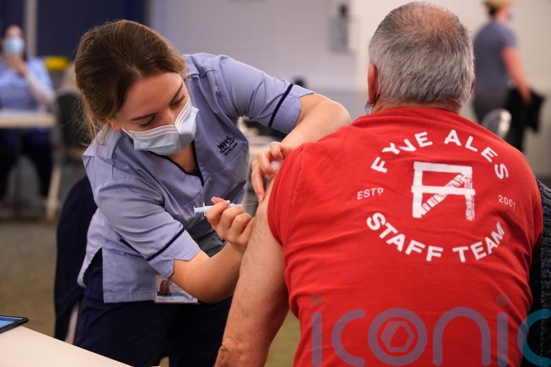 Call to prioritise booster jab rollout as NHS faces staffing crisis