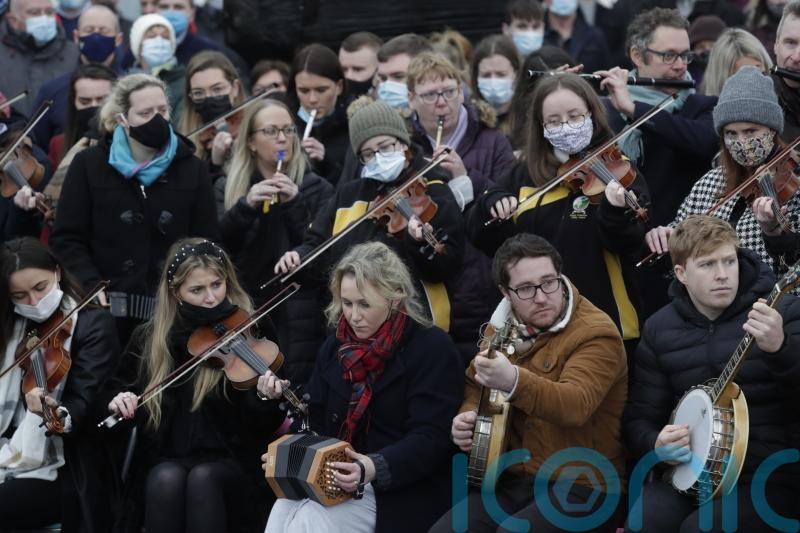 Tin whistles and tears, as thousands gather for funeral of Ashling Murphy