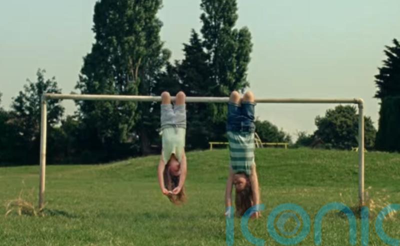 Dairylea ad banned over two girls eating while hanging upside down