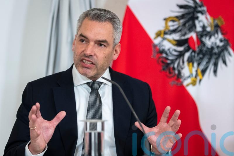 Austrian parliament approves universal vaccine mandate