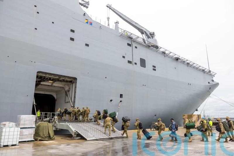 Australian navy ship with Covid-infected crew offloads aid to Tonga