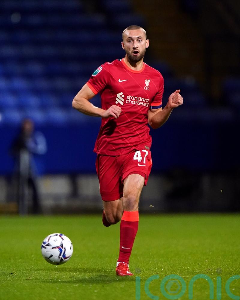 Liverpool defender Nat Phillips being chased by two Premier League clubs