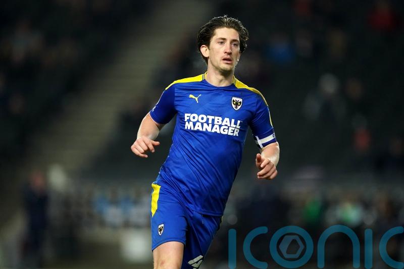 AFC Wimbledon waiting on Alex Woodyard ahead of Shrewsbury clash