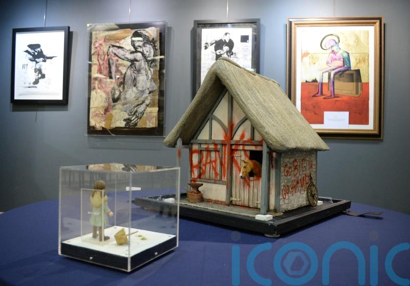 Model village owners laughing all the way to the Banksy after £1m sale