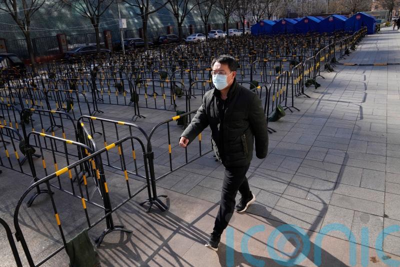 Beijing seals off more residential areas as Covid cases increase