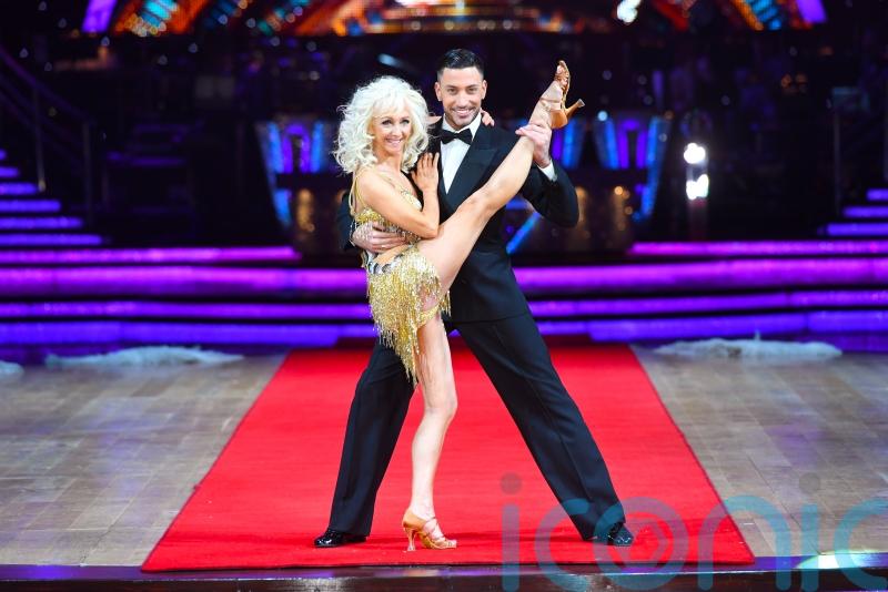 Debbie McGee shows off flexibility by doing splits live on Good Morning Britain