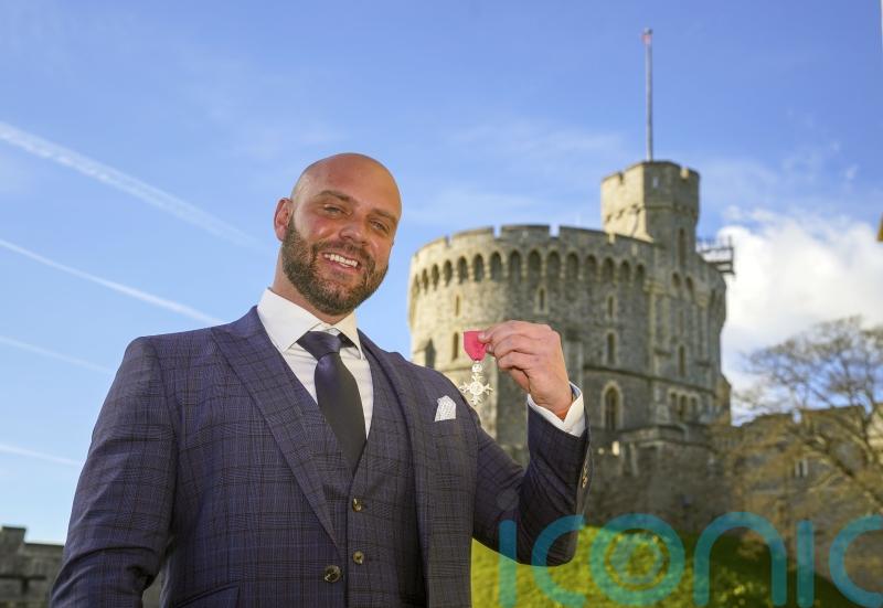 Personal trainer collects MBE after walking to Windsor from Middlesbrough