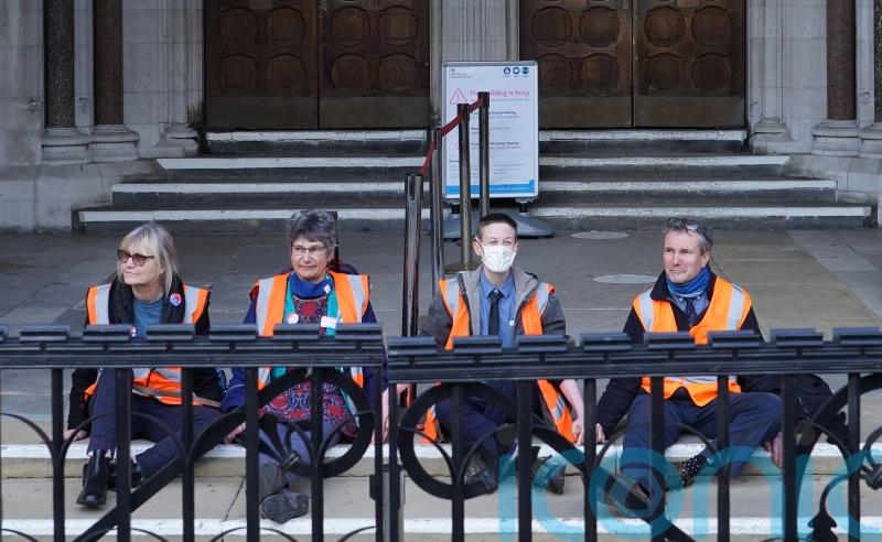 Insulate Britain protesters in custody after gluing themselves to court steps