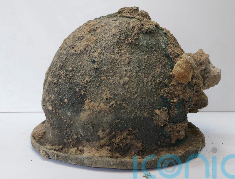 Ancient helmets found alongside temple ruins during dig in Italy