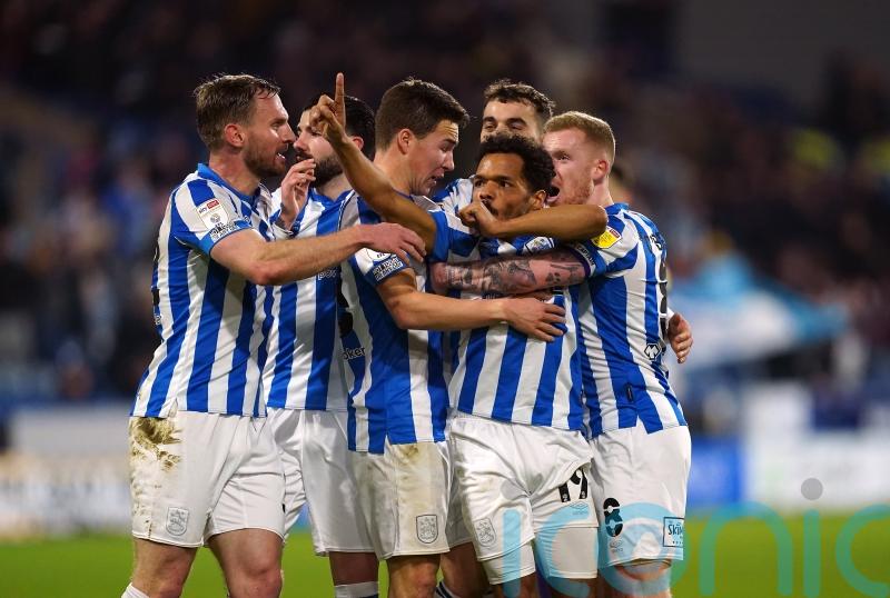 Huddersfield finally break down 10-man Derby to move into play-off spots