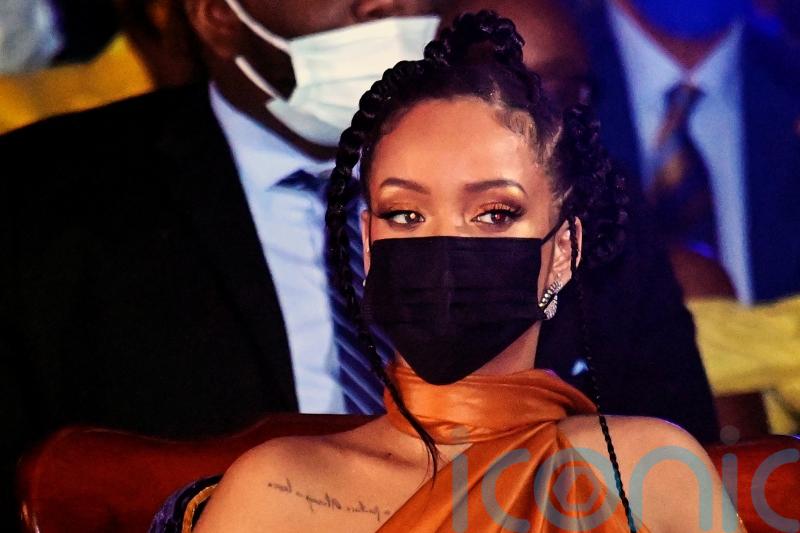 Rihanna shares photos of baby bump as she introduces her new ‘gang’