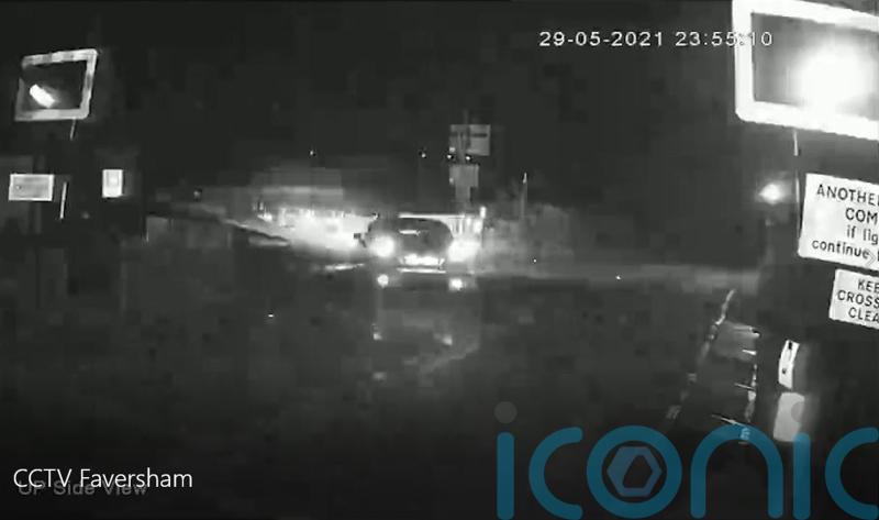 Shocking CCTV shows sparks flying as woman drunkenly drives on to rail line